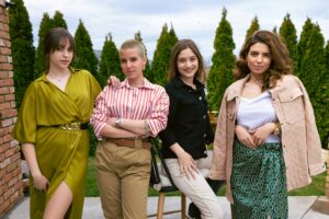 group of four confidently dressed women