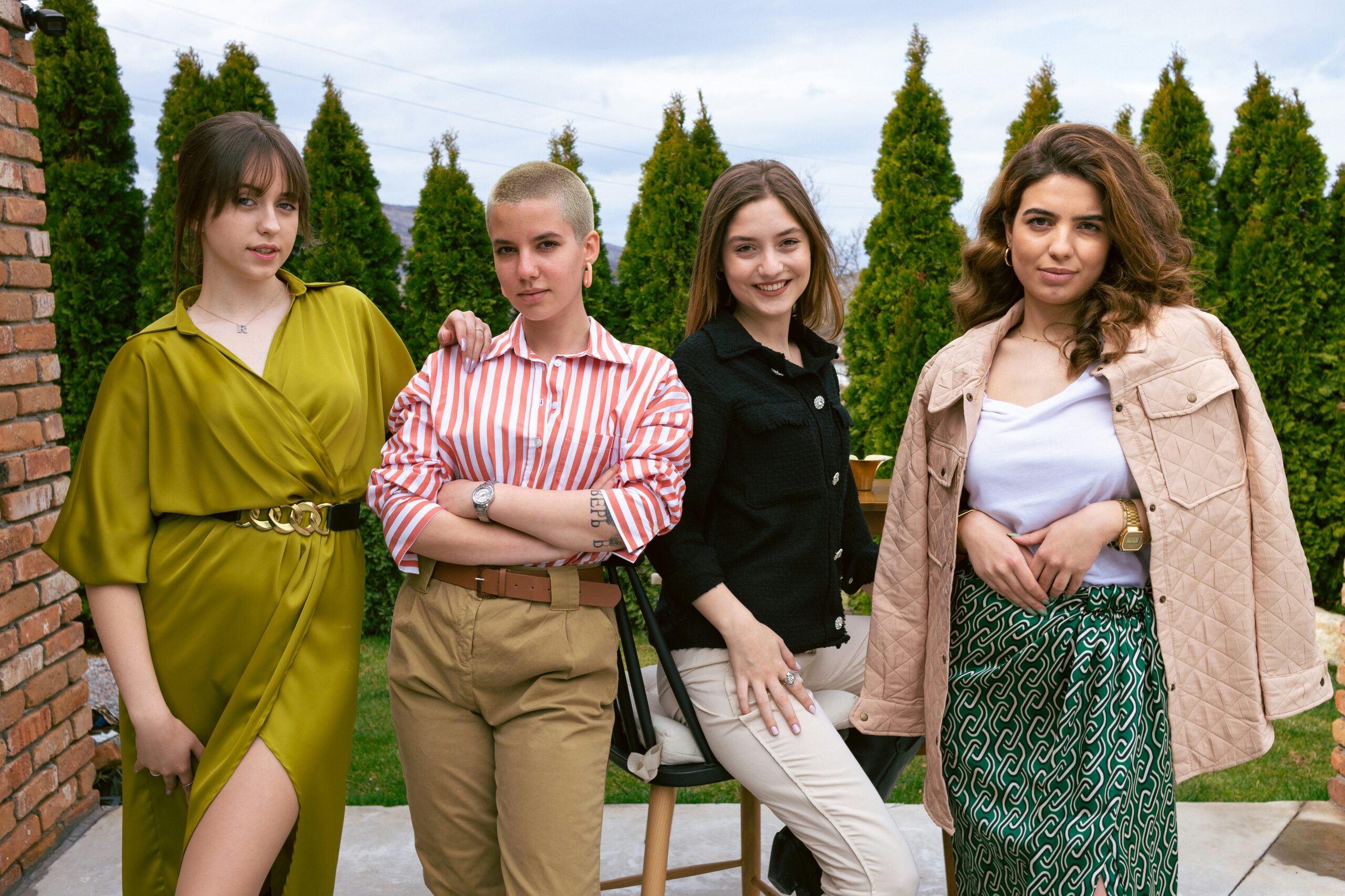 group of four confidently dressed women